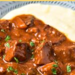 A bowl of mashed potatoes and beef bourguignon