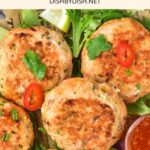 Top down view of salmon cakes topped with sliced chilies.