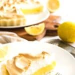 A slice of lemon meringue pie on a plate.