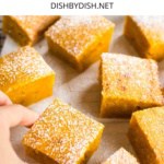 Hand reaching for a pumpkin square.