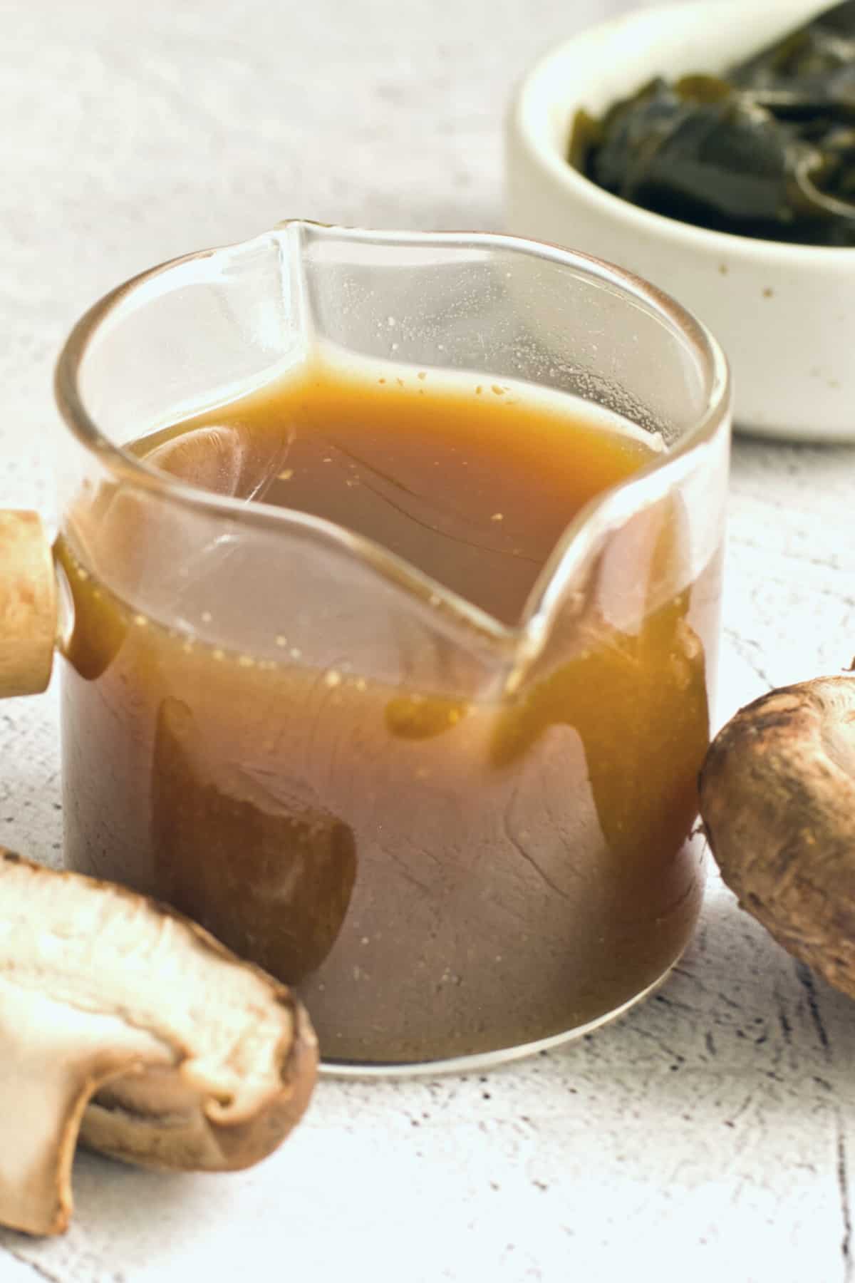 A glass jar with homemade vegan fish sauce.