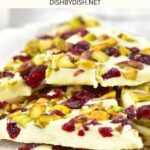 Up close shot of white chocolate bark on parchment paper.
