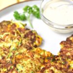A plate of crispy gluten-free zucchini fritters