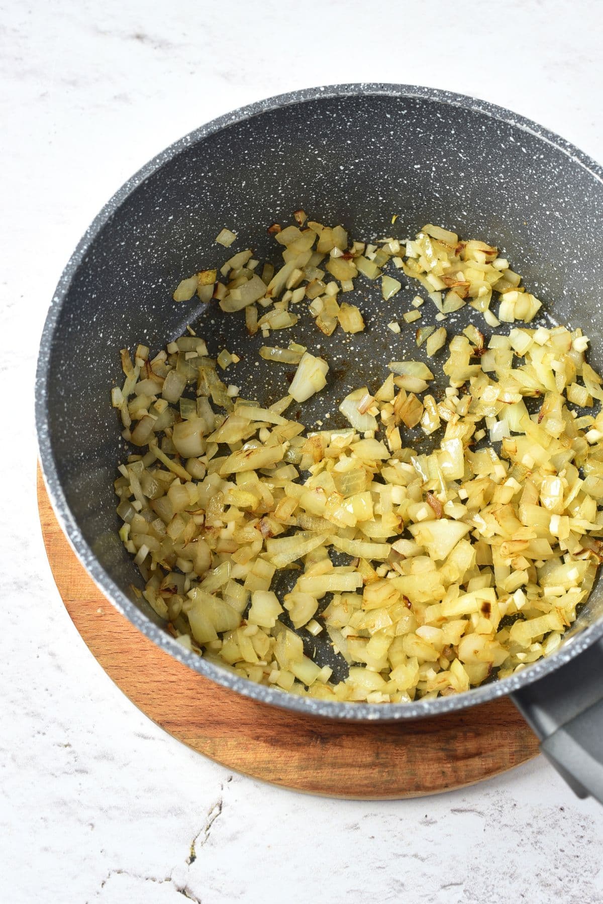 Sautéed diced onions in saucepan