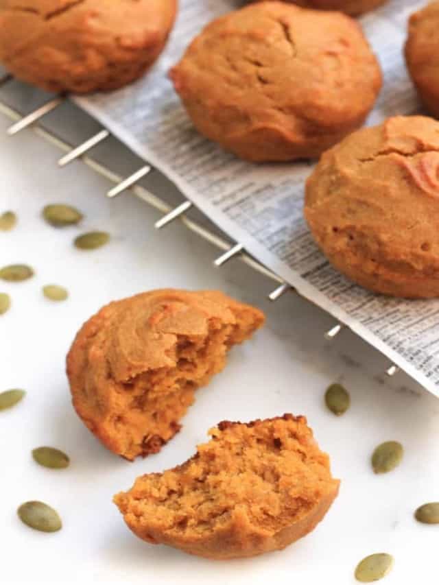 resized image pumpkins muffins on steel rack with pumpkins seeds on white board